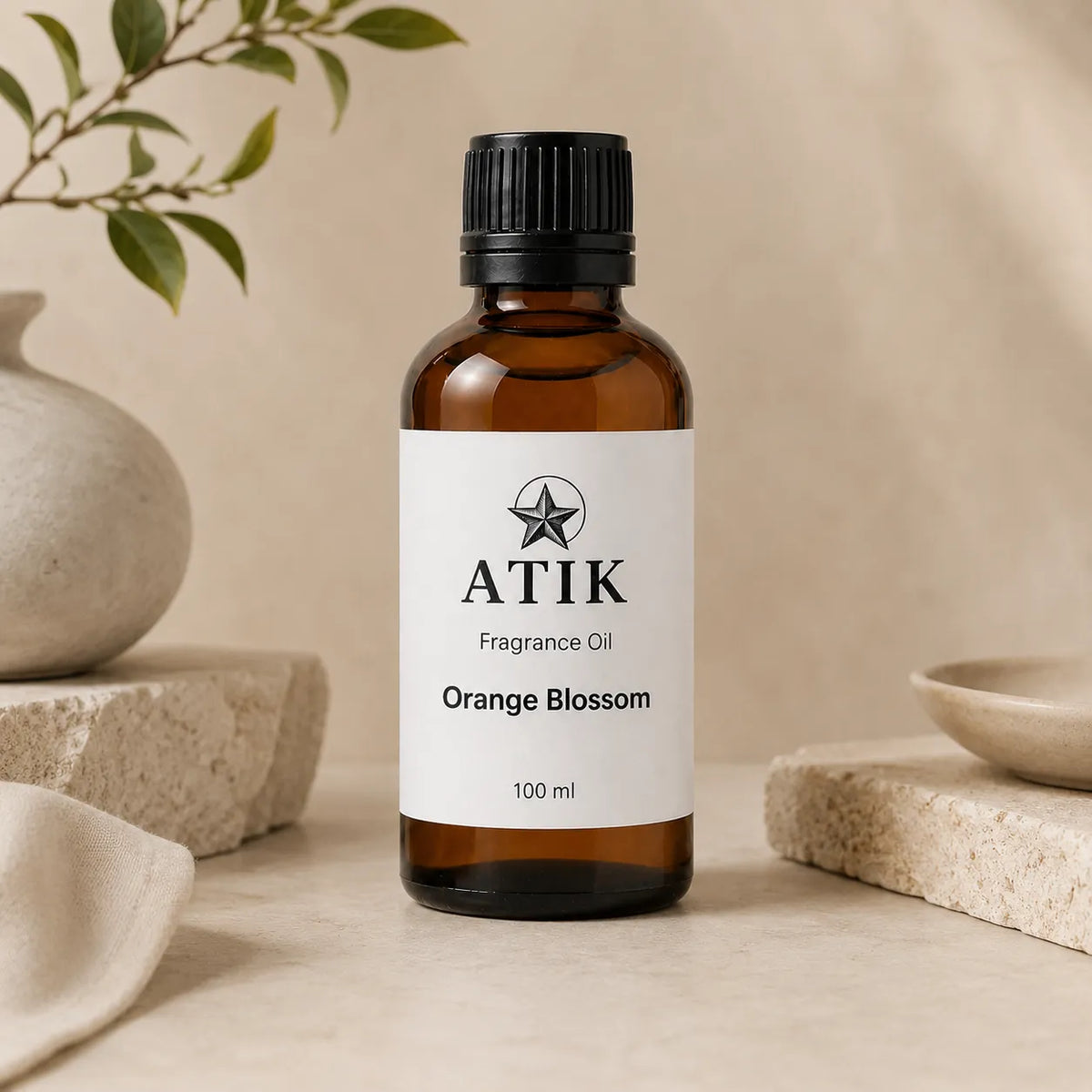 ATIK fragrance oil bottles in amber glass with white labels