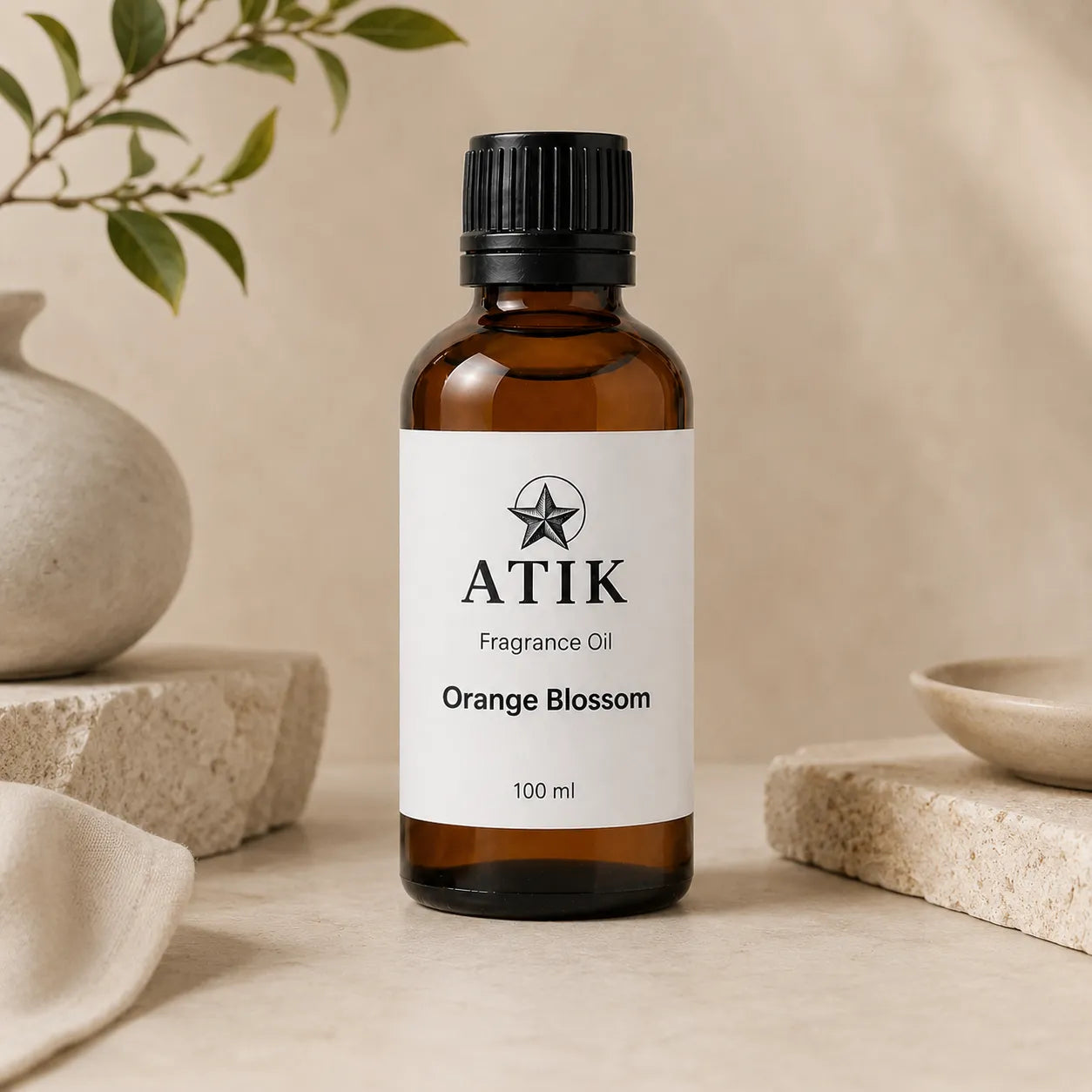 ATIK fragrance oil bottles in amber glass with white labels