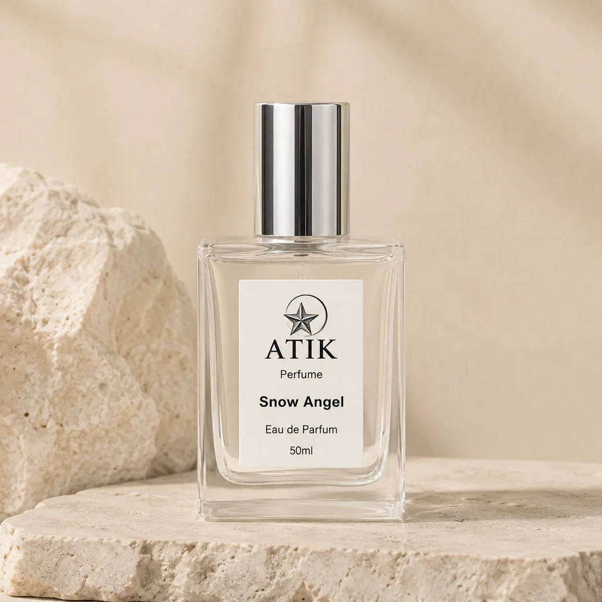 ATIK perfume spray bottle in a clean neutral product setting