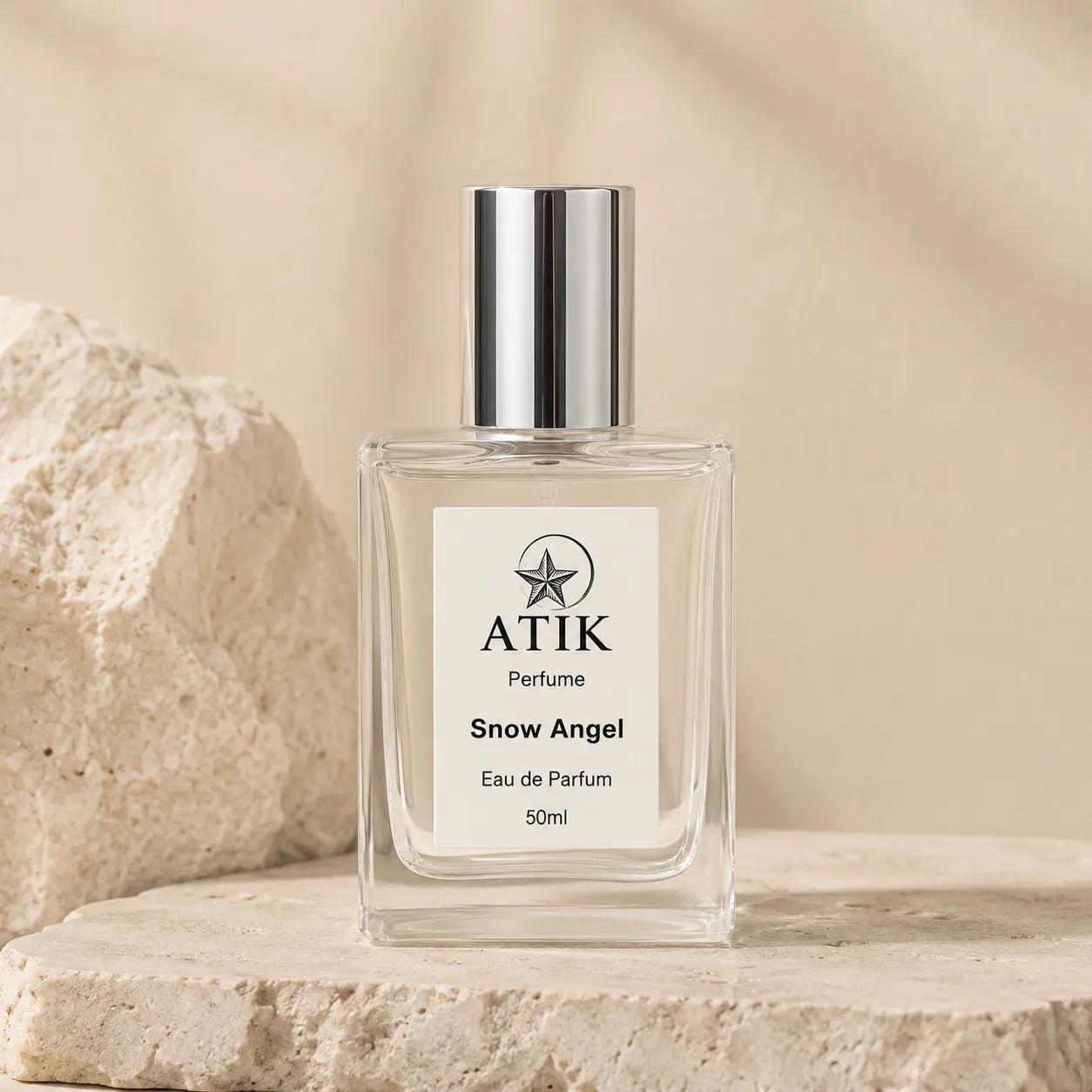 ATIK perfume spray bottle in a clean neutral product setting